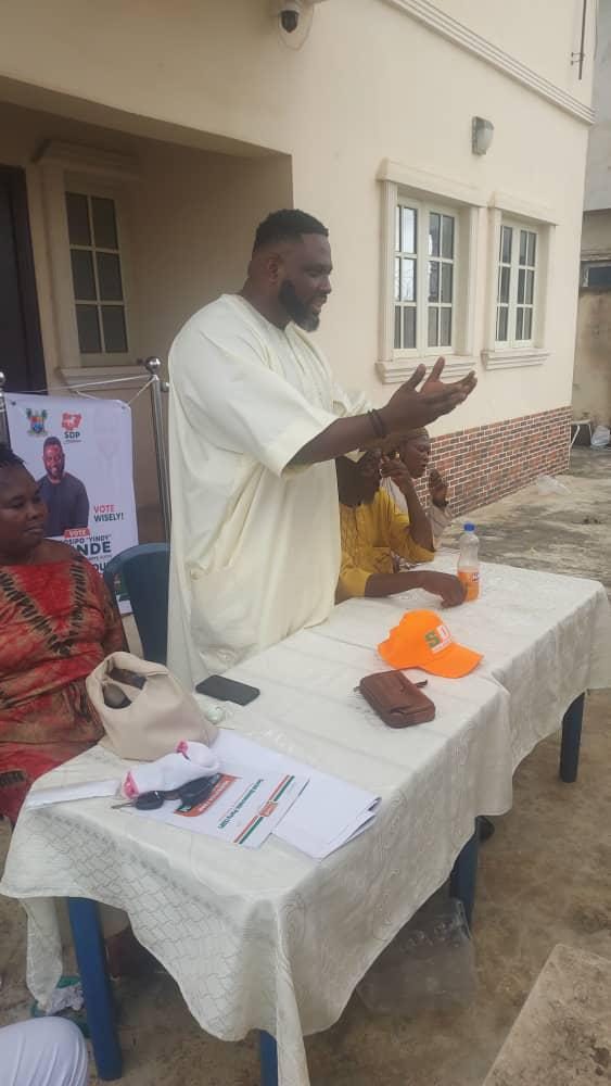 Yindy energetically addressing a community gathering
